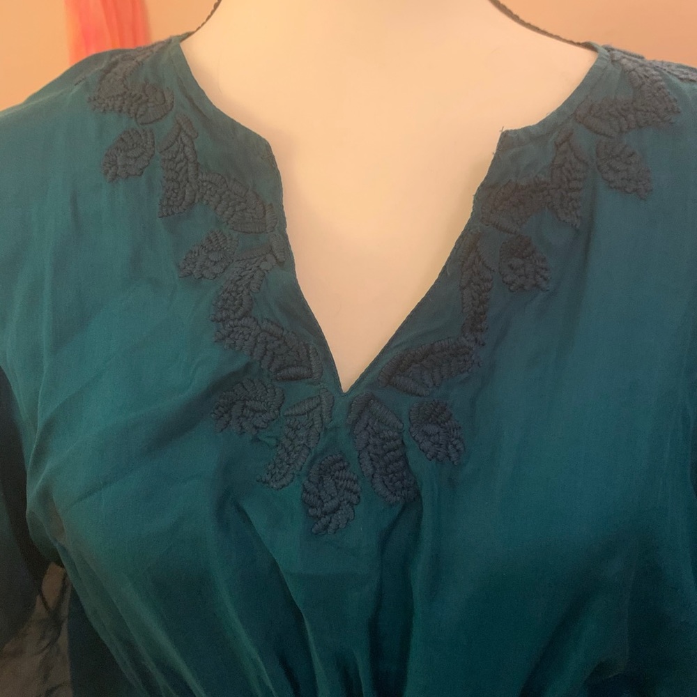 Large teal blouse with winged sleeves